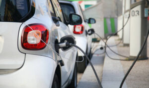 Smart electric car charging at a power station in Paris, France.