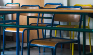 Rows of chairs in a classroom, during the covid-19 pandemic